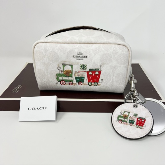 Coach Handbags - Coach small boxy cosmetic case mirror bag charm sign Christmas train